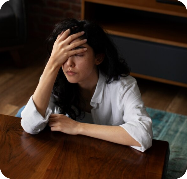 ayurveda ayursentials ojas drops imbalance women hand on head stressed desk housewife mum tired sleep